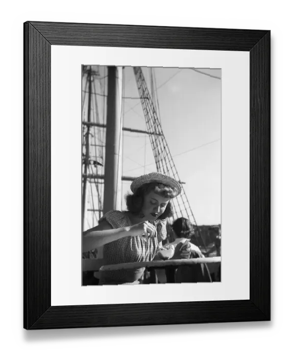 Framed Print : In the 1940s. A young woman is visiting Swedens captial city Stockholm and is pictured enjoying the sunshine