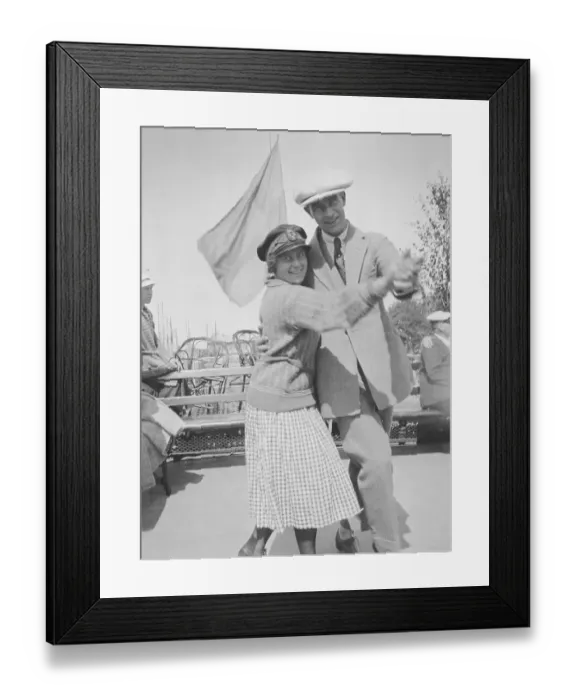 Framed Print : Dancing in he 1920s. A young couple dancing outside holding each other Framed Print : Dancing in he 1920s. A young couple dancing outside holding each other