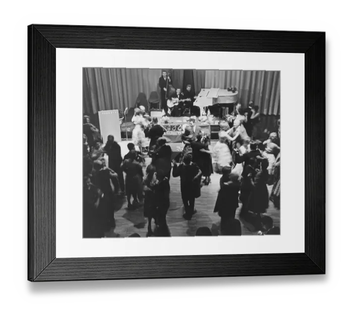 Framed Print : Dancing in the 1960s. A band is playing and the dance floor is filled with dancing couples that are enjoying themselves