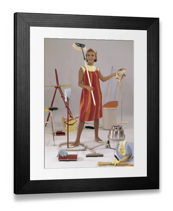 Framed Print : Cleaning day in the 1960s. A young woman is pictured with mops, vacuum-cleaner, buckets, cloths. Things and objects typically used in the 1960s when cleaning the house Framed Print : Cleaning day in the 1960s. A young woman is pictured with mops, vacuum-cleaner, buckets, cloths. Things and objects typically used in the 1960s when cleaning the house