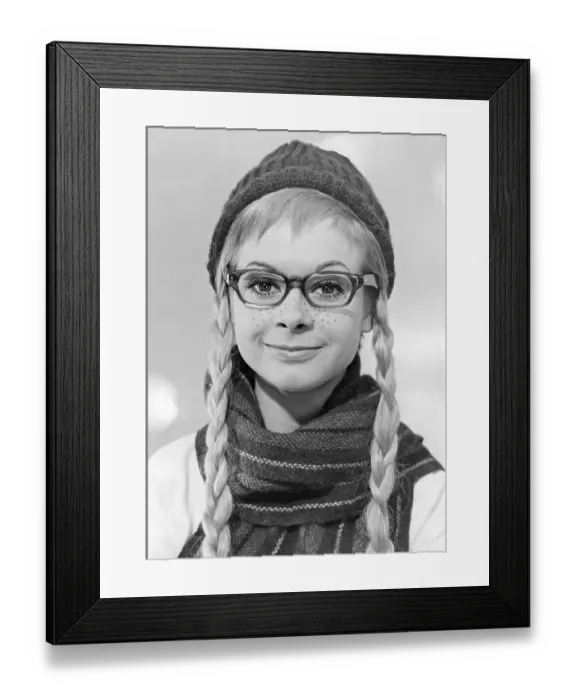 Framed Print : 1960s glasses. A young woman in glasses and bows in January 1961 Framed Print : 1960s glasses. A young woman in glasses and bows in January 1961
