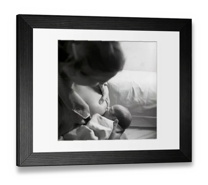 Framed Print : 1950s mother nursing her baby. A young woman breastfeeding her baby at home. Sweden 1951 Neg CV / 24