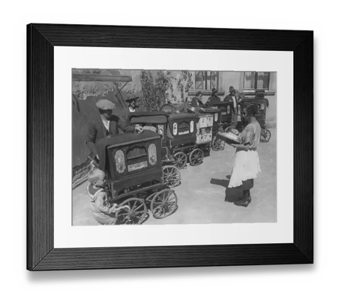 Framed Print : Organ grinders of the 1930s