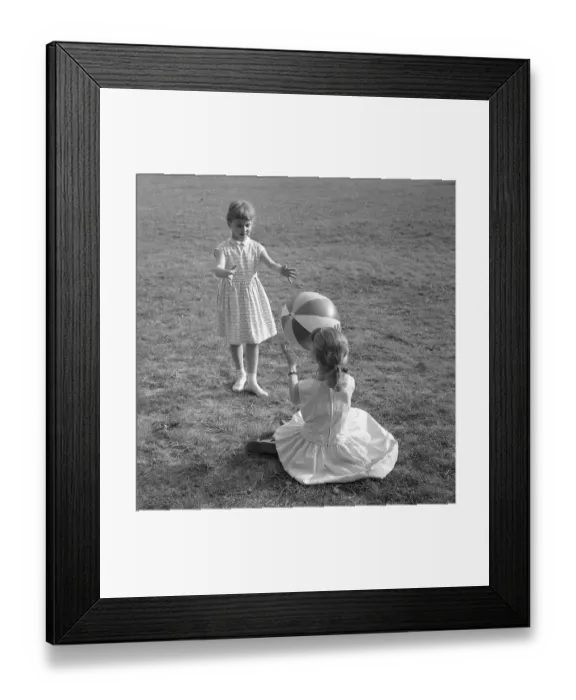Framed Print : Summer activitiy in the 1950s. Two girls are playing with a ball on a summers dag 1957 Framed Print : Summer activitiy in the 1950s. Two girls are playing with a ball on a summers dag 1957