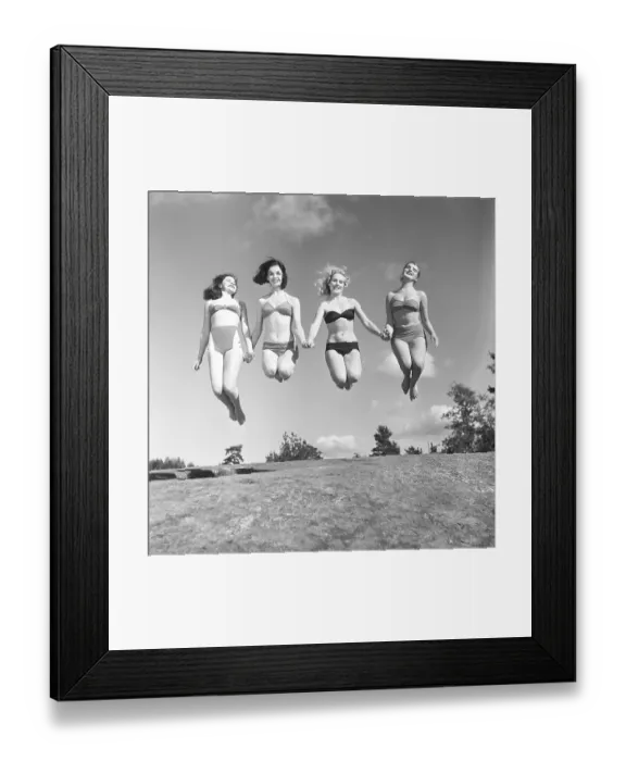 Framed Print : 1950s summer. A group of young women in their bikinis are happy on this summer's day