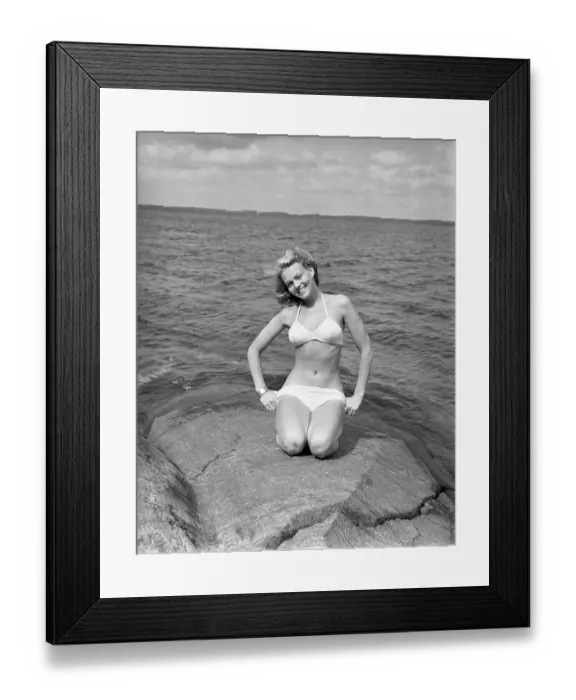 Framed Print : 1940s bikinifashion. A swedish young woman in a white bikini on a summer's day