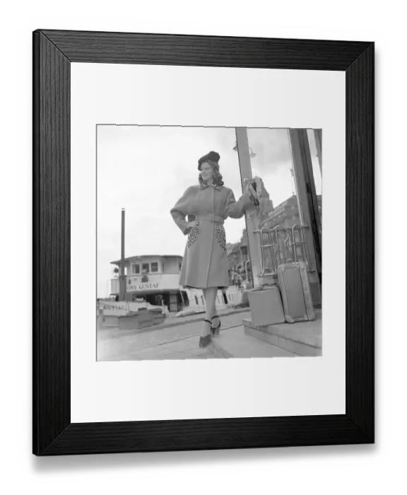 Framed Print : Women's fashion in the 1940s. A young woman in a typical 1940s coat with leopard patterned details
