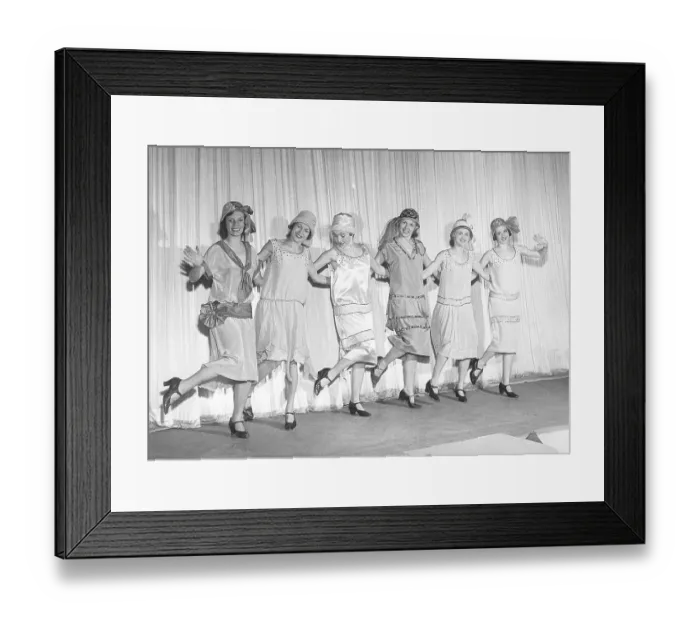 Framed Print : 1920s remake. A group of women at a theatre are posing on stage in typical 1920s dresses and hats Framed Print : 1920s remake. A group of women at a theatre are posing on stage in typical 1920s dresses and hats