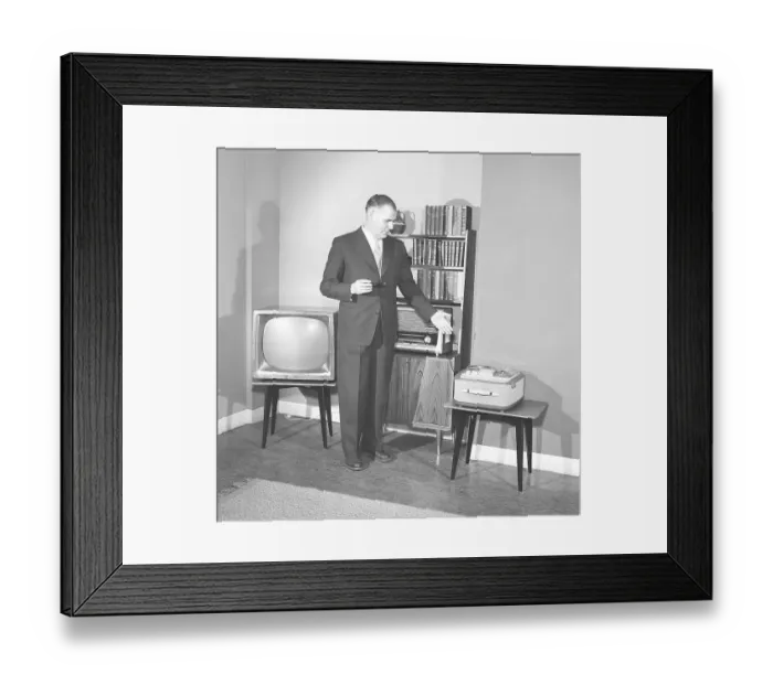 Framed Print : Television in the 1950s. A proud elderly man is pictured in his home with the latest in electronic home equipment