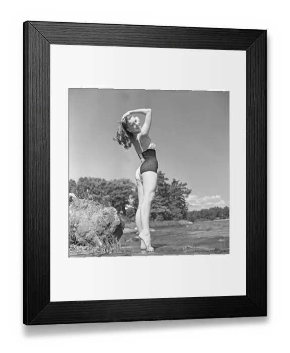 Framed Print : 1940s swimsuit fashion. A swedish young woman in a swimsuit on a summer's day