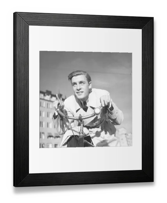Framed Print : 1940s man on a bicycle. The Swedish actor Alf Kjellin on a bicycle holding the handlebars. Sweden 1940. Photo Kristoffersson 157-6 Framed Print : 1940s man on a bicycle. The Swedish actor Alf Kjellin on a bicycle holding the handlebars. Sweden 1940. Photo Kristoffersson 157-6