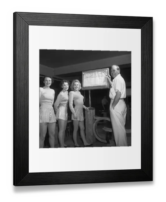 Framed Print : Bowling in the 1950s. A man with three young women in a bowling alley