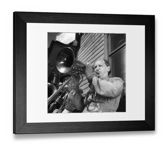 Framed Print : 1940s musical woman. An elderly lady in an all-women band is playing a horn instrument