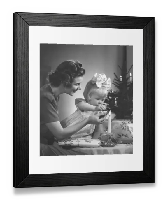 Framed Print : Christmas in the 1940s. A mother and her daughter is making nice christmas presents Framed Print : Christmas in the 1940s. A mother and her daughter is making nice christmas presents