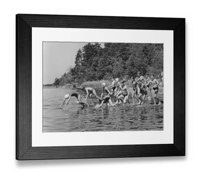 Framed Print : 1960s summer. It's a sunny summer day and the children are running into the water Framed Print : 1960s summer. It's a sunny summer day and the children are running into the water