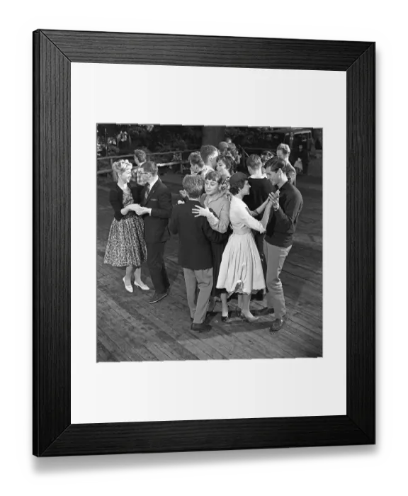 Framed Print : Dancing in the 1950s. A nice outdoor summer dance event where young couples are dancing and having fun
