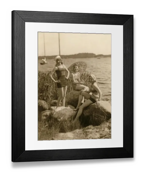 Framed Print : Having fun in the 1930s. Three young women on the beach dressed in the 1930s fashion of bathing suits