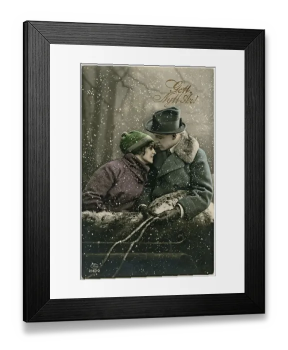 Framed Print : Happy New Year 1920s. A Happy New Years card from 1929 with a couple in a snowfall