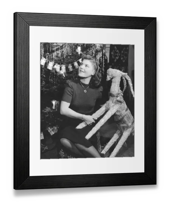 Framed Print : Christmas in the 1940s. The young figure skating Britta Rahlen is celebrating christmas at home in the 1940s Framed Print : Christmas in the 1940s. The young figure skating Britta Rahlen is celebrating christmas at home in the 1940s