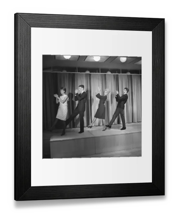 Framed Print : Dancing in the 1960s. The dance Hully Gully is being made popular and here are men and women dancing the new craze