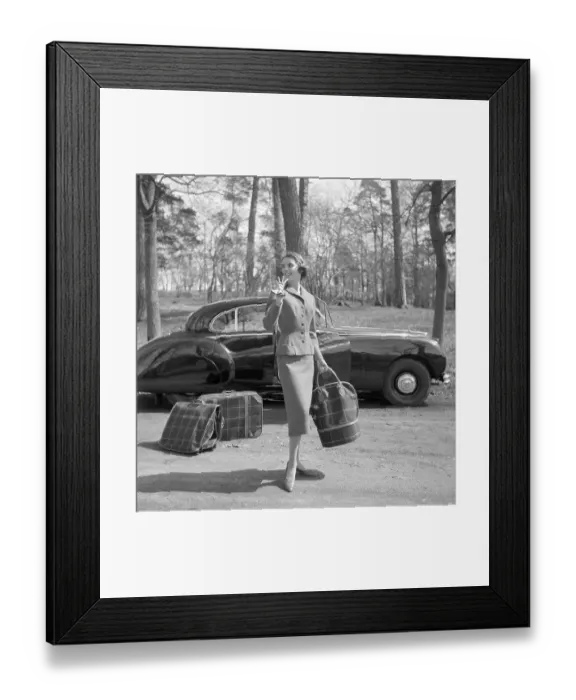 Framed Print : In the 1950s. A young woman in a matching outfit of jacket and skirt Framed Print : In the 1950s. A young woman in a matching outfit of jacket and skirt