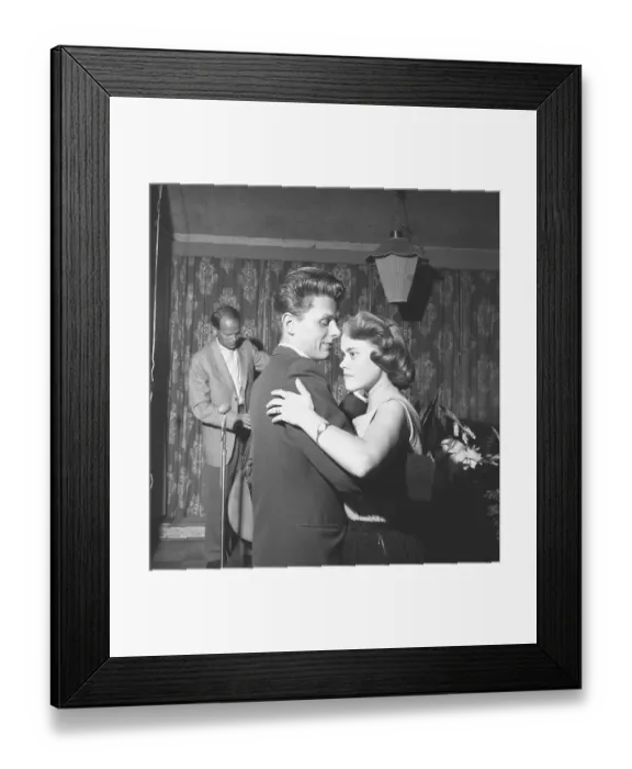 Framed Print : Dancing in the 1950s. A young couple is dancing Framed Print : Dancing in the 1950s. A young couple is dancing
