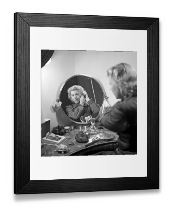 Framed Print : Woman combing her hair. Actress Irma Christenson