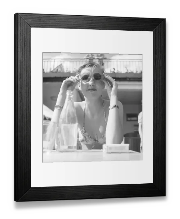 Framed Print : 1950s sunglasses. A young woman on a summer day is trying out her sunglasses. 1950s. Photo Kristoffersson / AZ47-4 Framed Print : 1950s sunglasses. A young woman on a summer day is trying out her sunglasses. 1950s. Photo Kristoffersson / AZ47-4