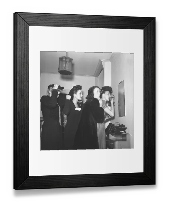 Framed Print : Women prepares for a night out in the 1940s