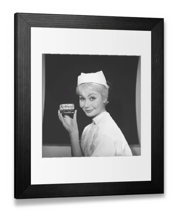 Framed Print : Beauty care in the 1950s. A young woman is holding a package of soap named Neutrogena