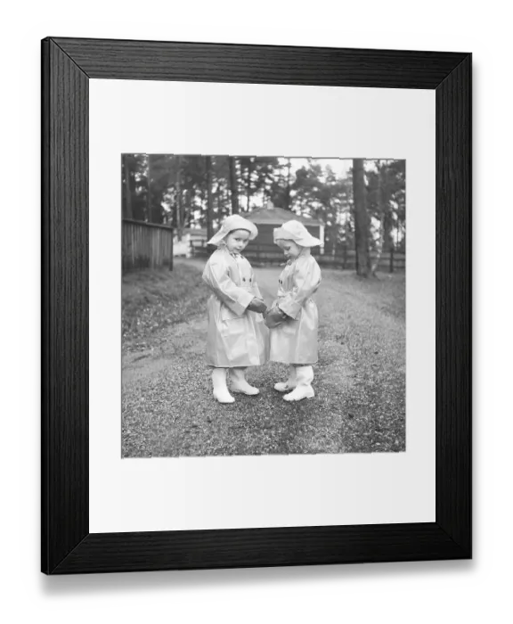 Framed Print : 1950s children in rain clothes