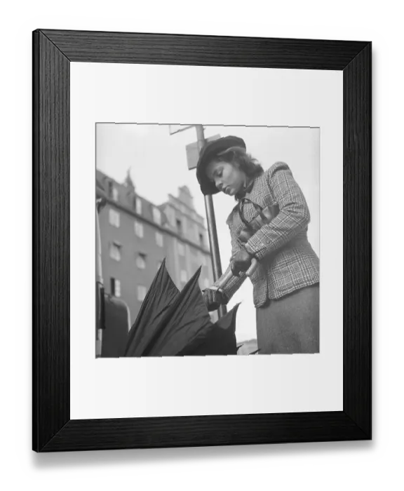 Framed Print : 1940s woman in raincoat. Actress Viveca Lindfors