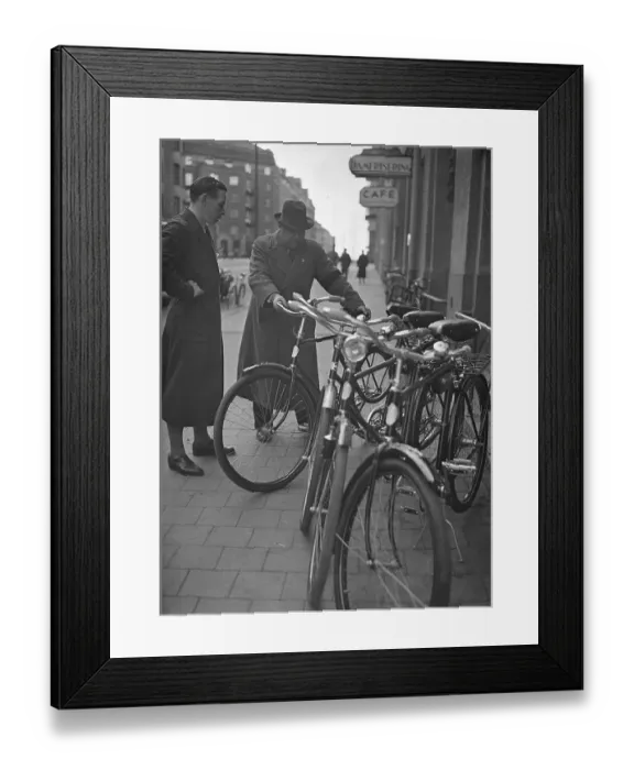 Framed Print : 1940s bicycle shop. The Swedish athlete and olympic cyclist champion Ingvar Eriksson outside his own bicycle shop where he sells and repairs bicycles. World War II has made petrol and oil expensive and rationed