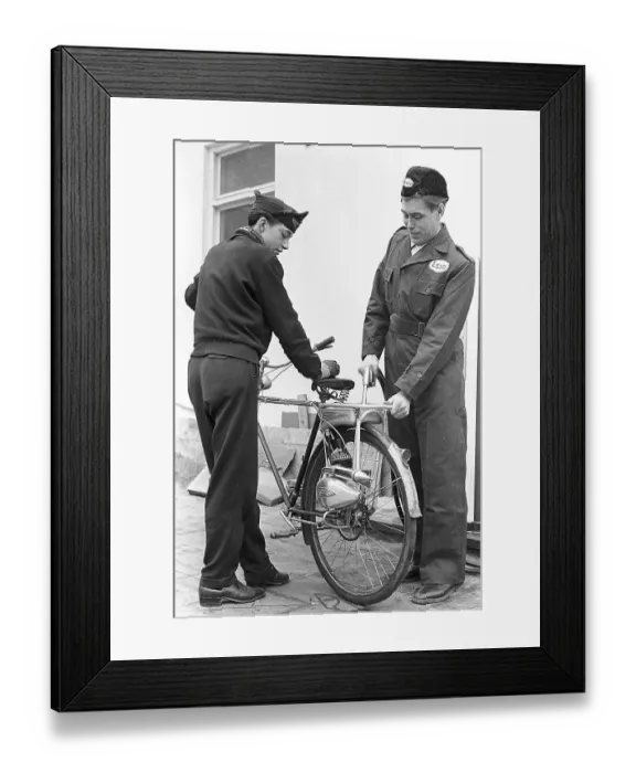 Framed Print : 1950s bicycle extra. The german moped and motor manufacturer Victoria supplies this bicycle help engine called Vicky