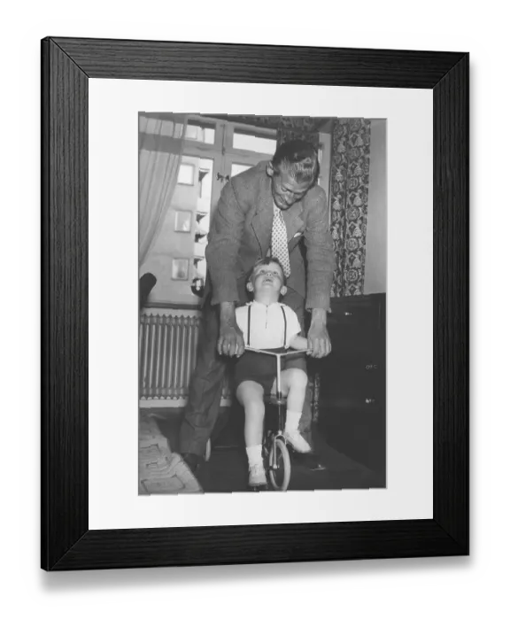 Framed Print : 1940s father and son with a tricycle Framed Print : 1940s father and son with a tricycle