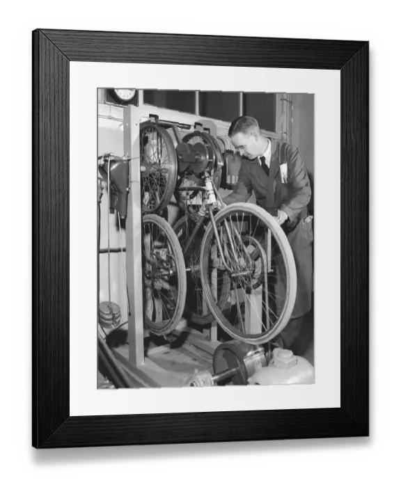 Framed Print : Factory in the 1950s. A worker at bicycle and motorcycle company Monark in Sweden Framed Print : Factory in the 1950s. A worker at bicycle and motorcycle company Monark in Sweden