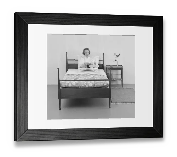 Framed Print : Woman of the 1950s. A young woman in bed with breakfast served for her on a tray Framed Print : Woman of the 1950s. A young woman in bed with breakfast served for her on a tray