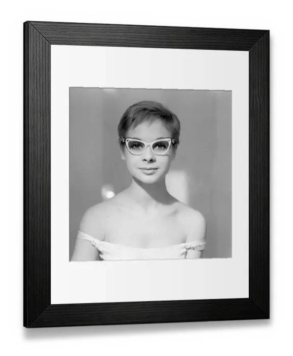 Framed Print : 1960s glasses. A young woman in glasses and bows January 1961