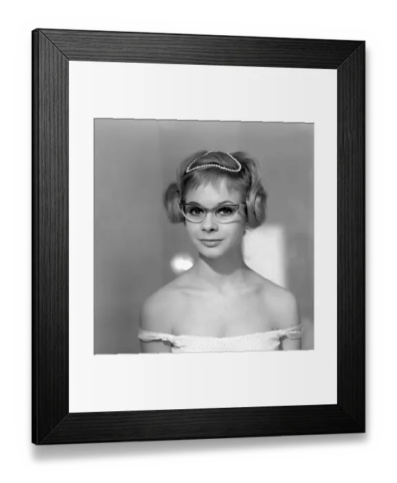 Framed Print : 1960s glasses. A young woman in glasses and bows January 1961 Framed Print : 1960s glasses. A young woman in glasses and bows January 1961