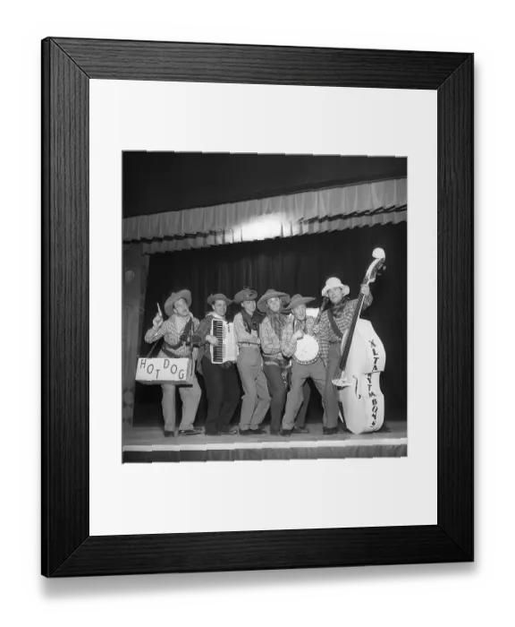 Framed Print : Music in the 1950s. A band on stage dressed up as cowboys playing their instruments