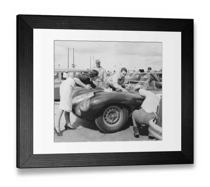 Framed Print : Racing car of the 1950s. The team makes the final polish of the car so it shines and looks good