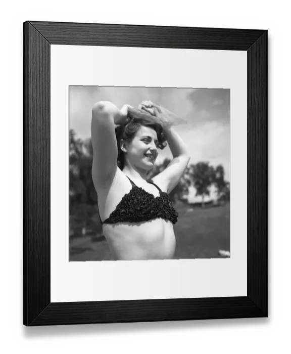 Framed Print : 1940s summer. A young woman in a bikini top Framed Print : 1940s summer. A young woman in a bikini top