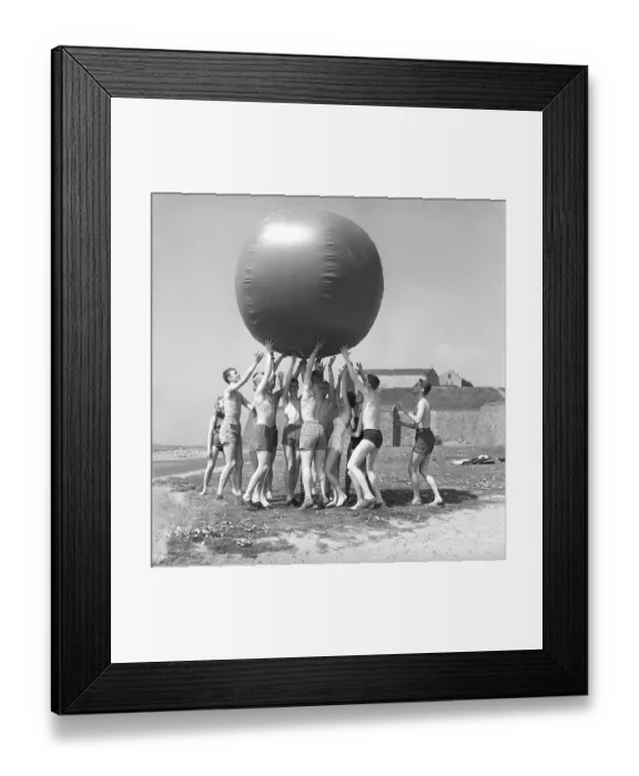 Framed Print : 1960s fun in the sun. A group of teenagers play on this sunny day