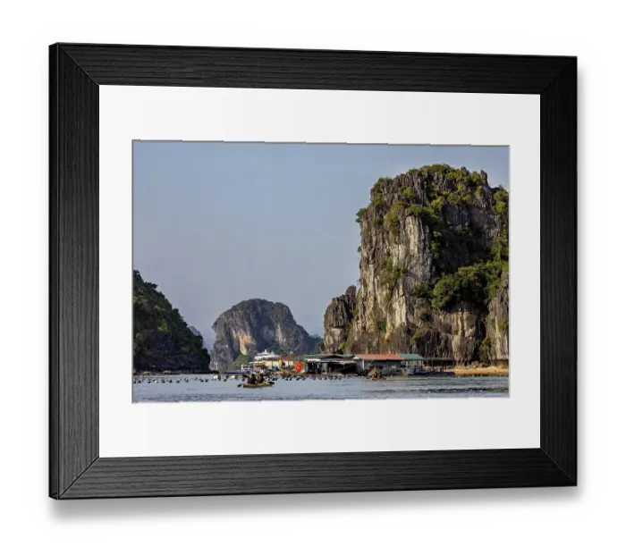 Framed Print : Boats in front of towering limestone cliffs on a clear summer's day