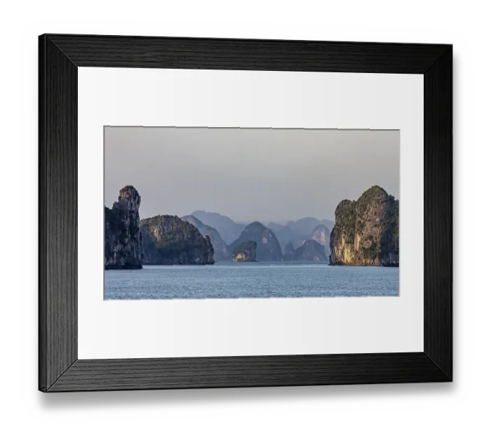 Framed Print : Mighty rocky islands in the soft light of dusk over a calm sea
