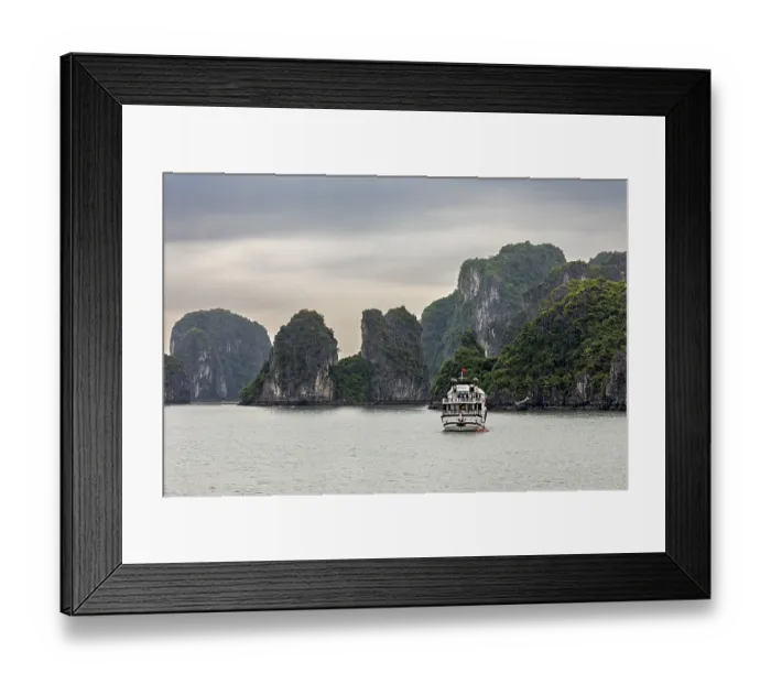 Framed Print : Ship sails in foggy waters surrounded by lush rock formations