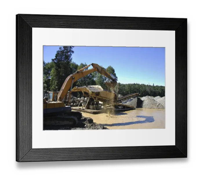 Framed Print : Digger feeding gravel into small gold screen