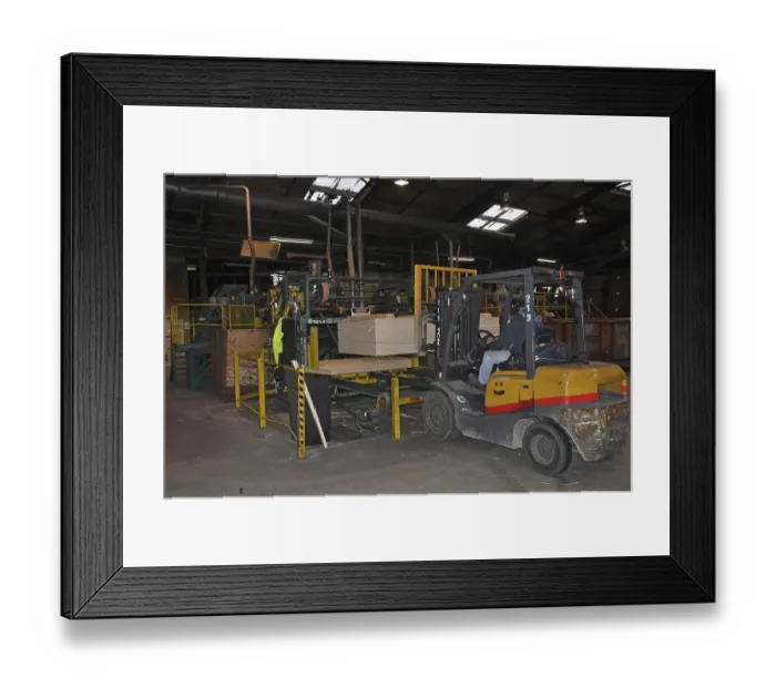 Framed Print : Forklift carries a pallet of completed plywood at the factory Framed Print : Forklift carries a pallet of completed plywood at the factory