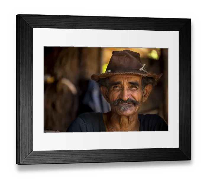 Framed Print : Sugar cane farmer wearing a hat Framed Print : Sugar cane farmer wearing a hat