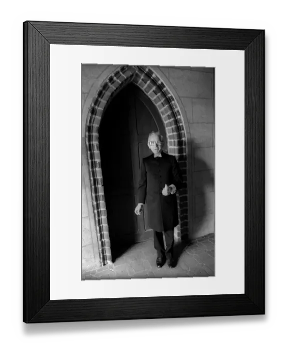 Framed Print : Germany, Stepnitz, 30.04.1992, Pastor with candle in front of the church in Stepnitz